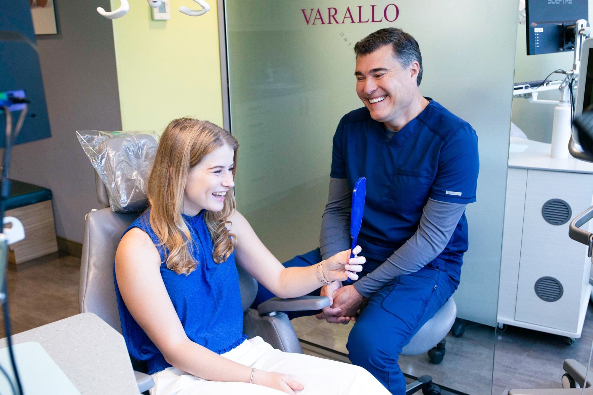 teen girl smiling during consultation with dr. varallo