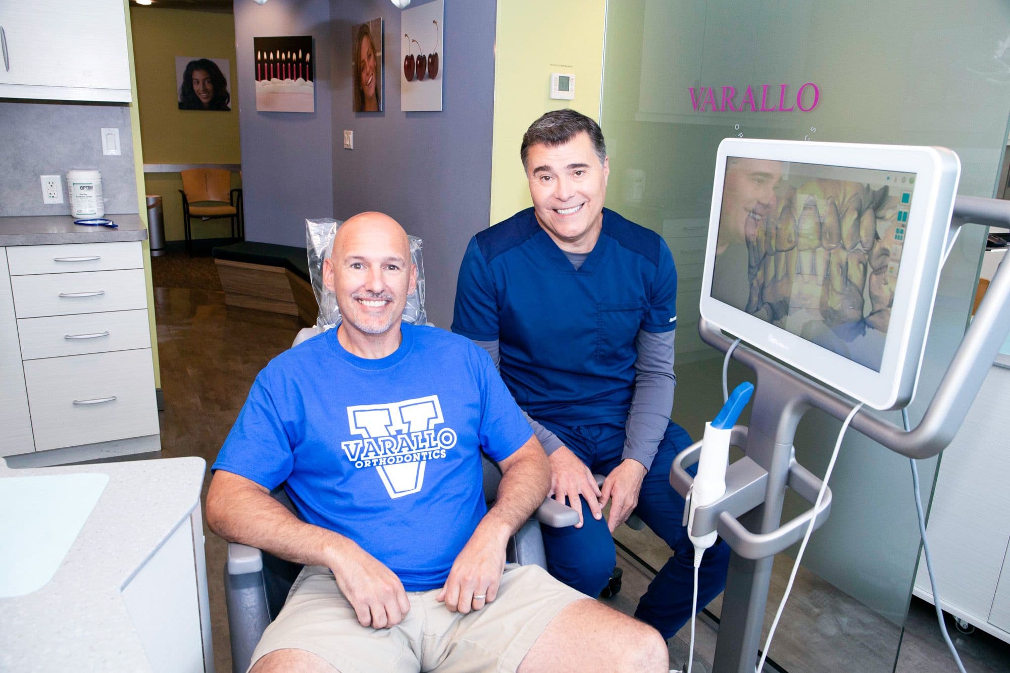 Dr. Varallo with a patient reviewing a 3D scan of his teeth